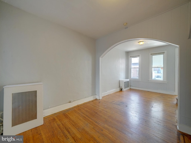 unfurnished living room featuring wood-type flooring