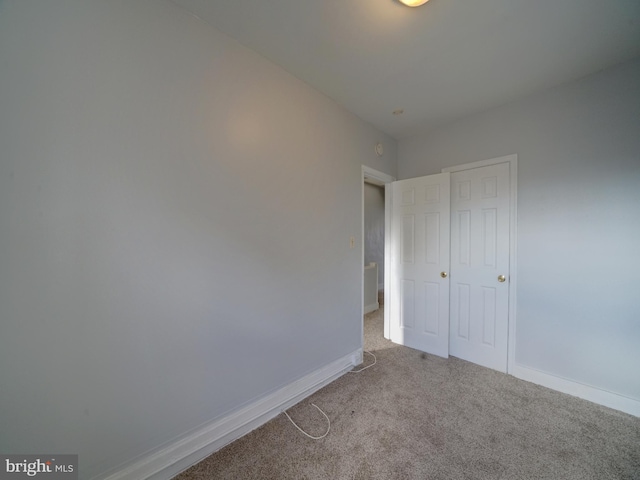 unfurnished bedroom featuring carpet flooring