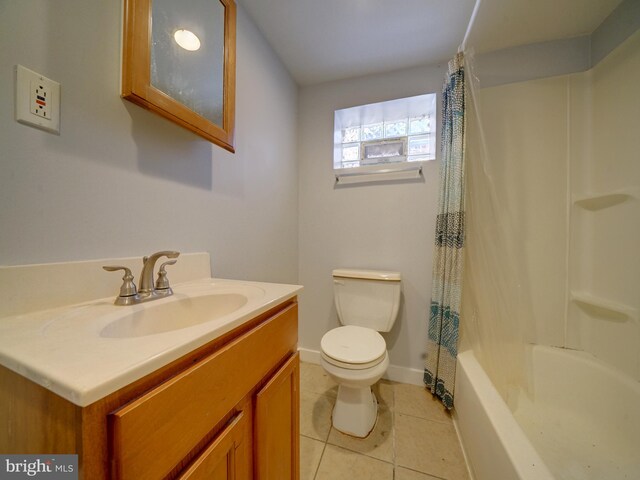 full bathroom with toilet, shower / bath combo, vanity, and tile patterned floors