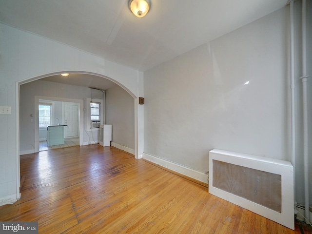 unfurnished room with light hardwood / wood-style flooring and cooling unit