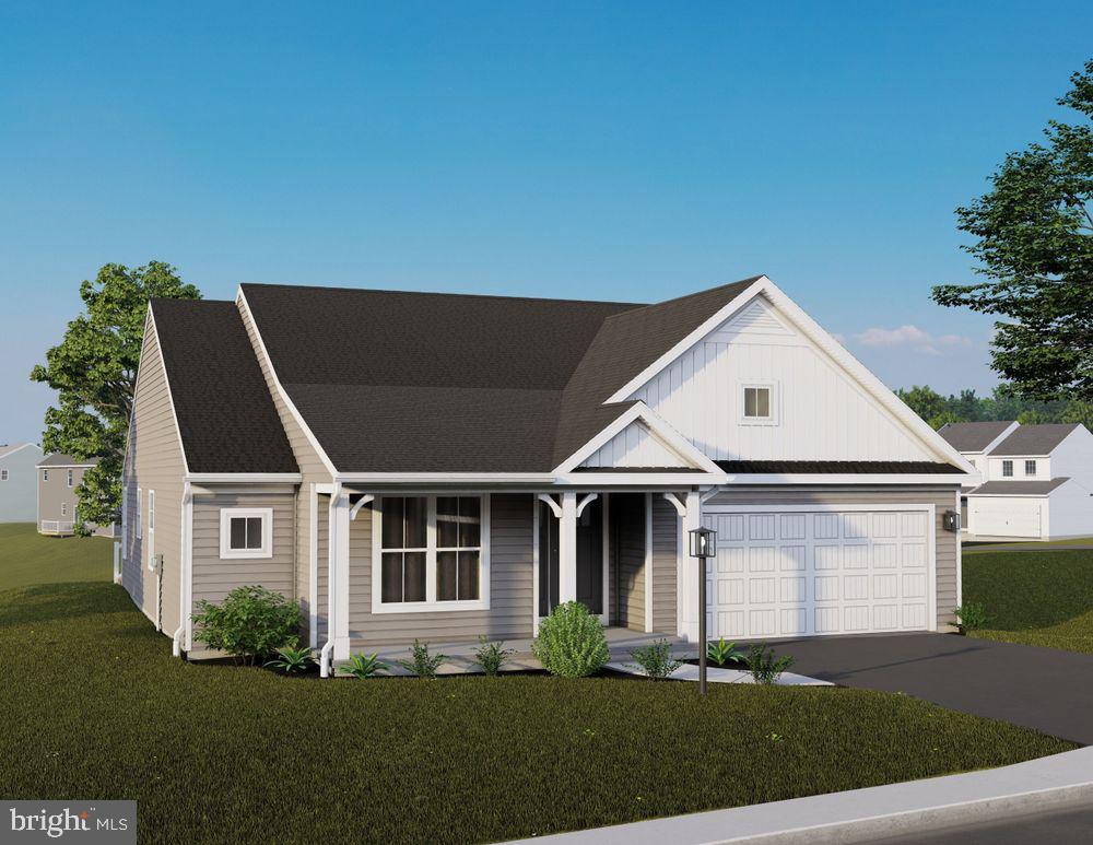 view of front of home featuring a front yard and a garage