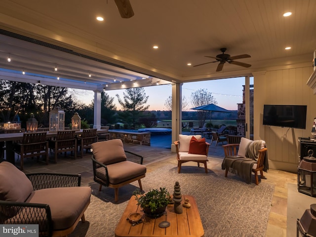 view of patio featuring ceiling fan, an outdoor living space, and a swimming pool