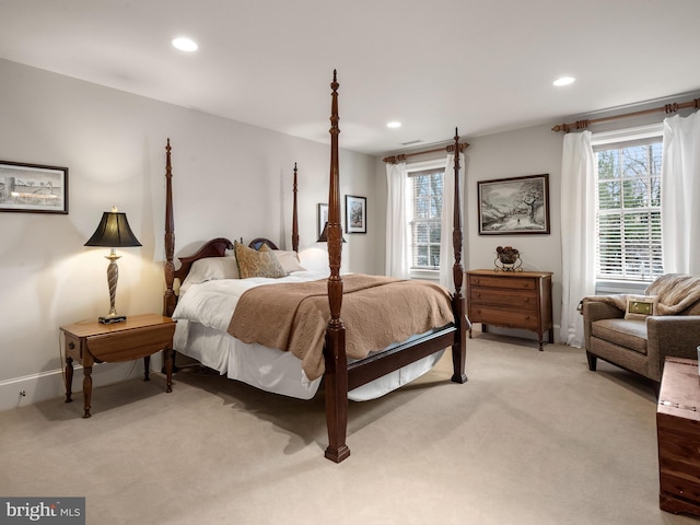 bedroom featuring light colored carpet