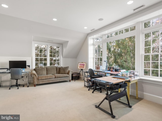 office space with light colored carpet and lofted ceiling