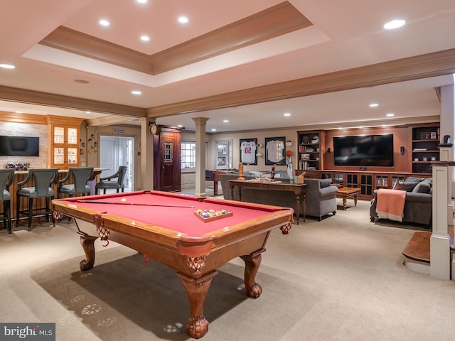 playroom with light carpet, ornate columns, a tray ceiling, crown molding, and billiards