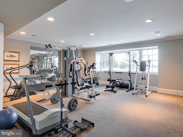 workout area featuring ornamental molding