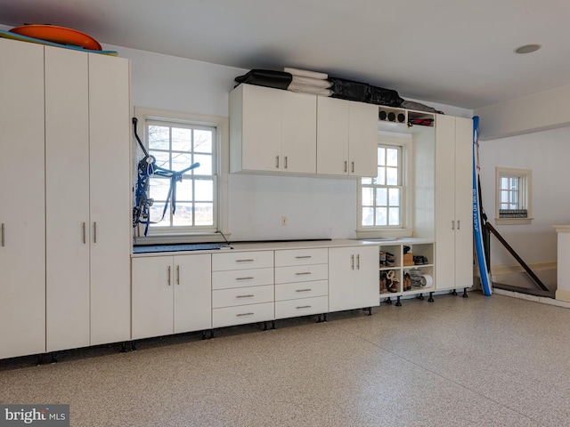 kitchen featuring white cabinetry and a healthy amount of sunlight