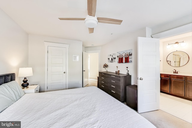 carpeted bedroom featuring sink, connected bathroom, and ceiling fan