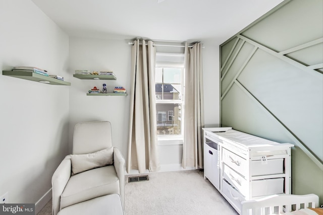 sitting room featuring carpet