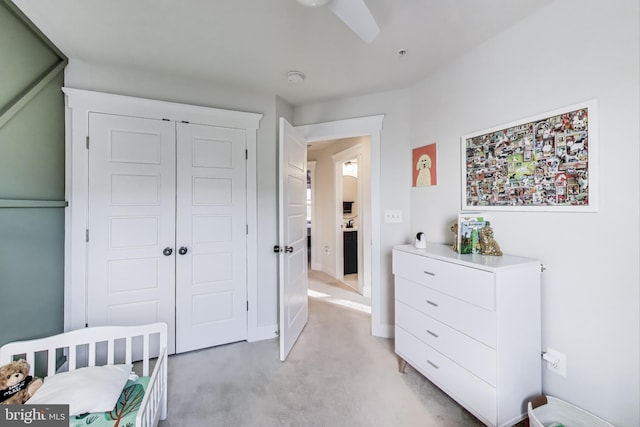 carpeted bedroom with a closet and ceiling fan