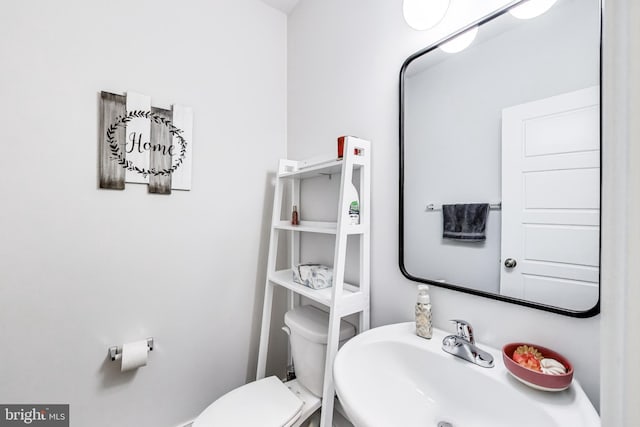 bathroom with sink and toilet