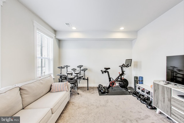 exercise room with light carpet