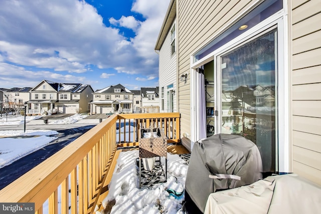 snow covered deck with grilling area