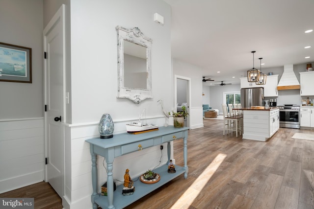 corridor with light hardwood / wood-style flooring