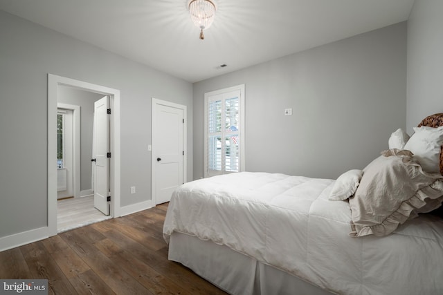 bedroom featuring dark hardwood / wood-style floors