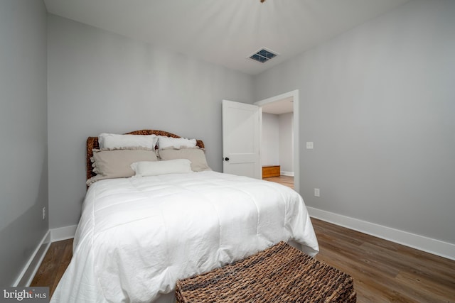 bedroom featuring dark hardwood / wood-style floors