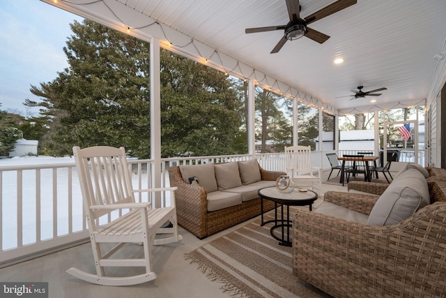 sunroom / solarium with ceiling fan