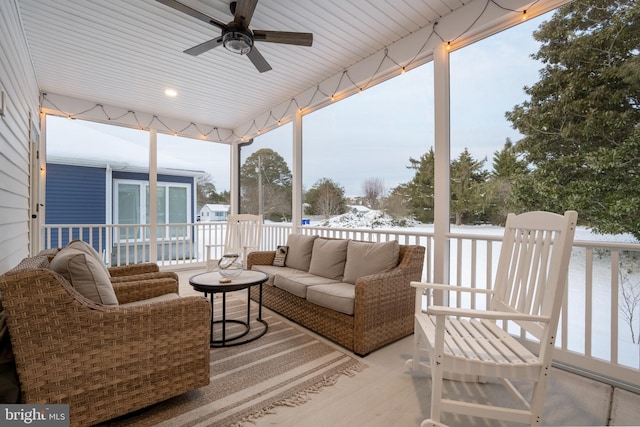 sunroom / solarium featuring ceiling fan and a healthy amount of sunlight