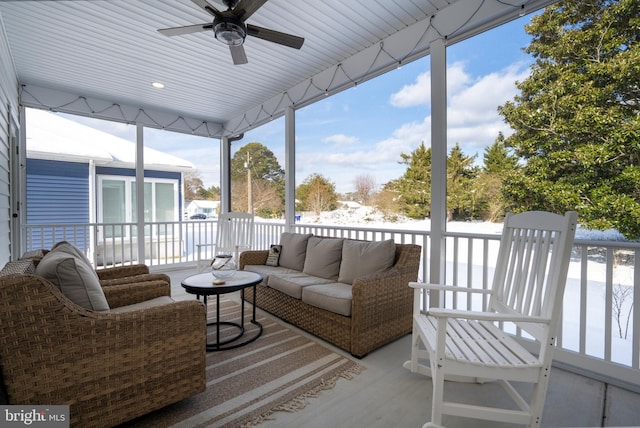 sunroom featuring ceiling fan