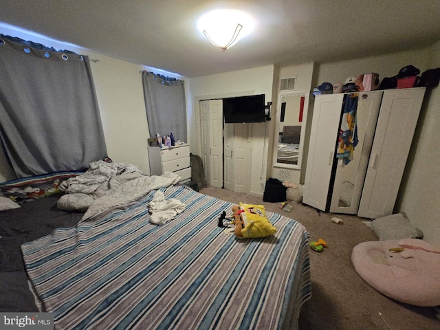 bedroom with carpet and a closet