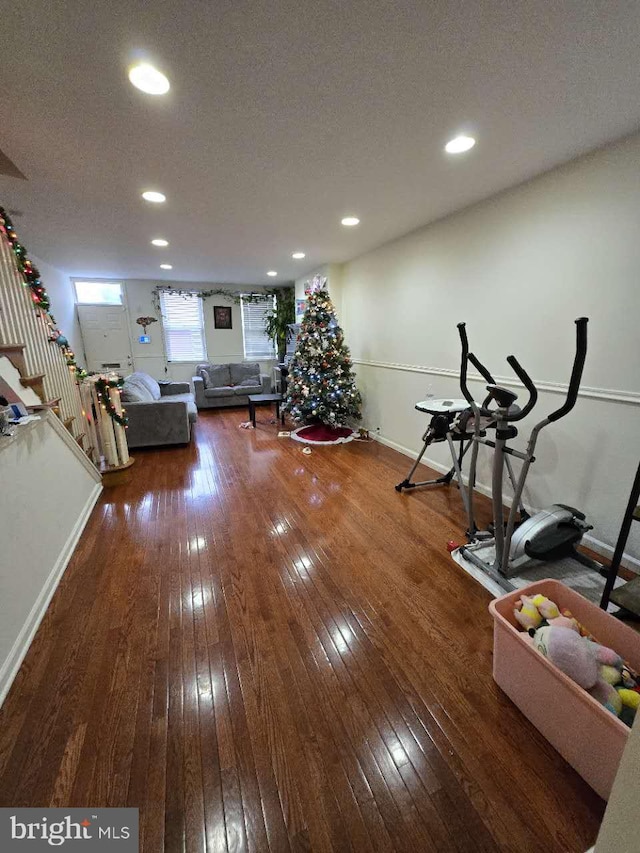 workout room with dark hardwood / wood-style floors and a textured ceiling