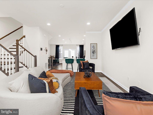 living room featuring hardwood / wood-style floors and ornamental molding