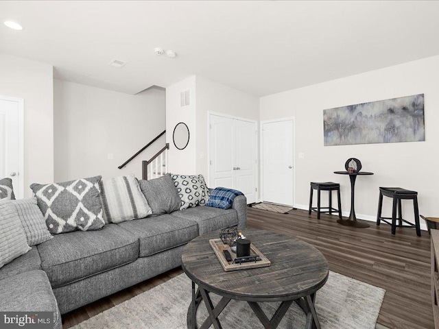 living room with dark hardwood / wood-style floors