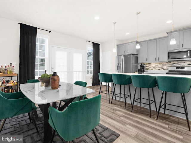 dining room featuring light hardwood / wood-style flooring