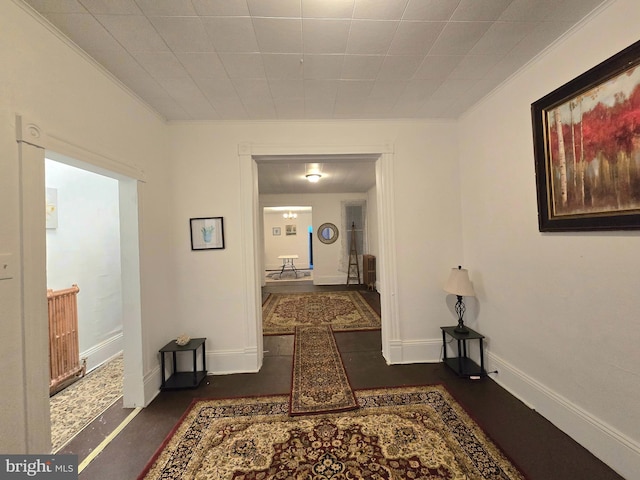 hallway featuring crown molding