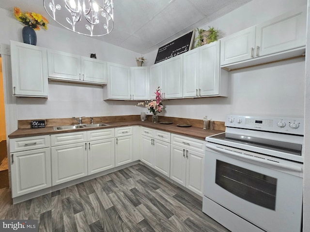 kitchen with dark wood-type flooring, white cabinets, sink, electric range, and butcher block countertops