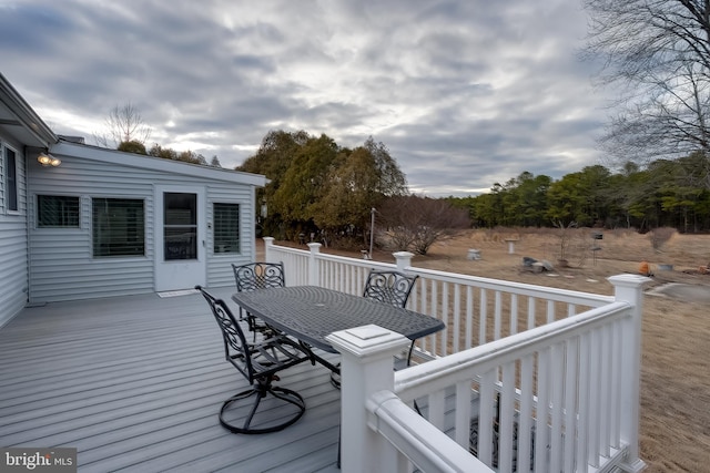 deck featuring outdoor dining area