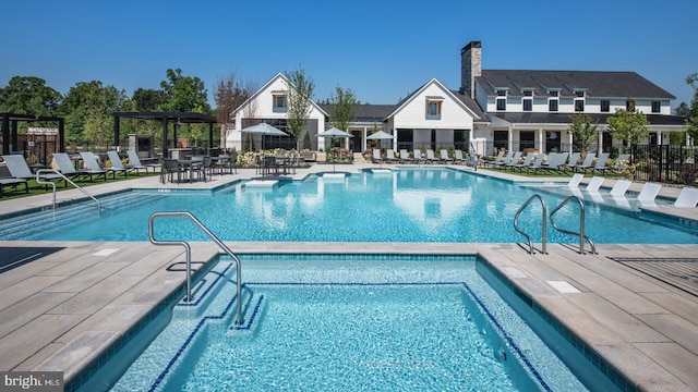 view of pool featuring a patio area