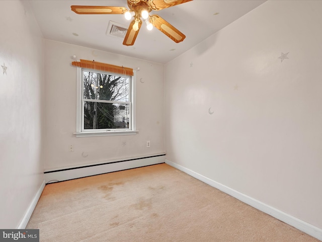 carpeted empty room featuring ceiling fan and a baseboard heating unit