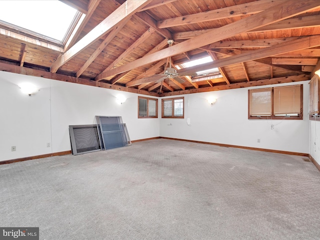 interior space with carpet flooring and wooden ceiling