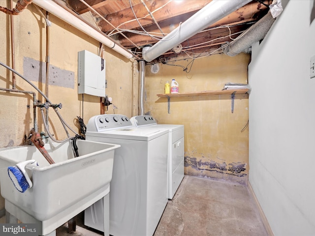 washroom featuring separate washer and dryer and sink