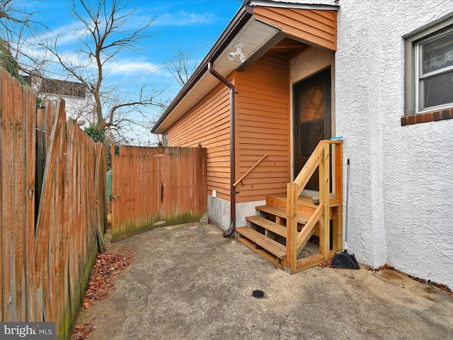 view of side of property with a patio area