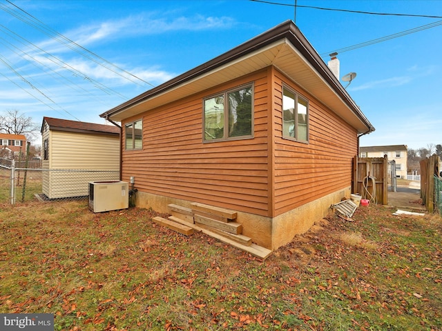 view of side of home featuring central air condition unit