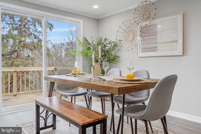 dining room featuring crown molding and wood-type flooring