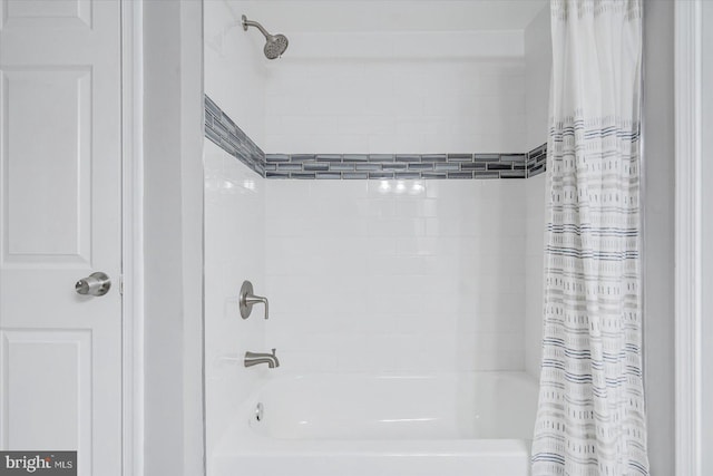 bathroom with shower / bathtub combination with curtain