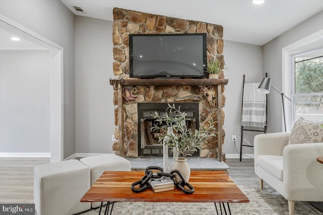 sitting room featuring light hardwood / wood-style floors and a fireplace