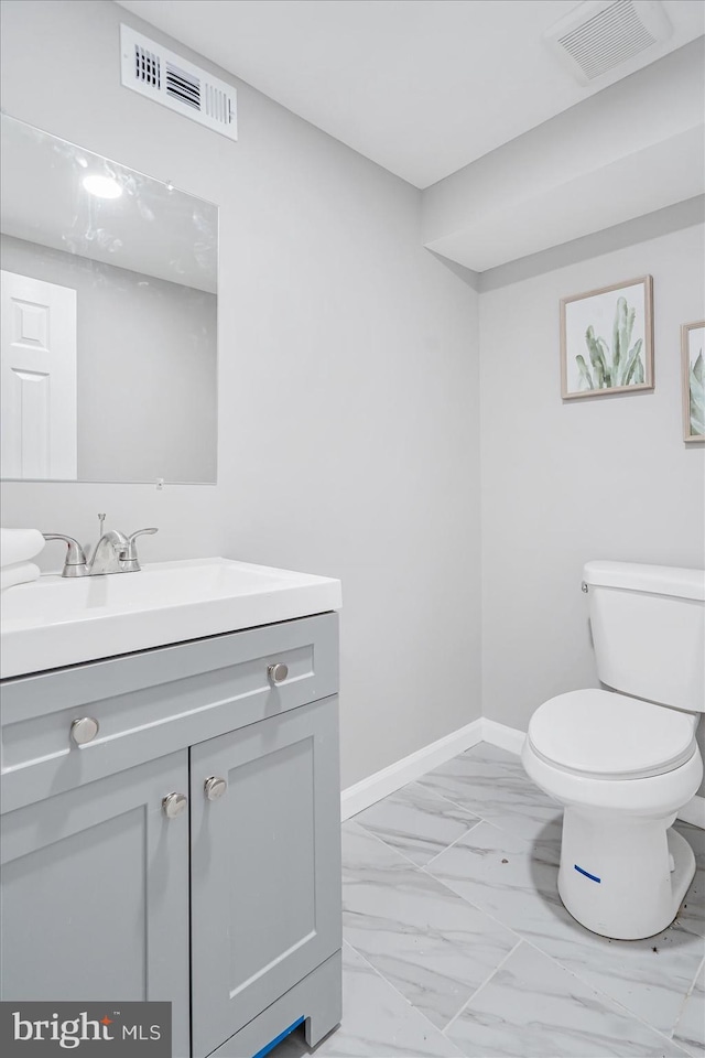 bathroom with vanity and toilet