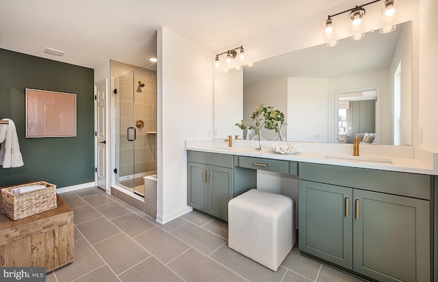 bathroom with tile patterned floors, vanity, and a shower with shower door