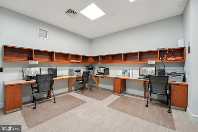 office area featuring light carpet and built in desk