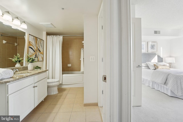 full bathroom with toilet, shower / bath combo, vanity, and tile patterned floors