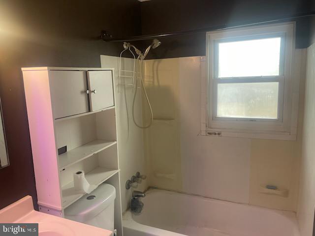 full bathroom with vanity, shower / bathtub combination, and toilet