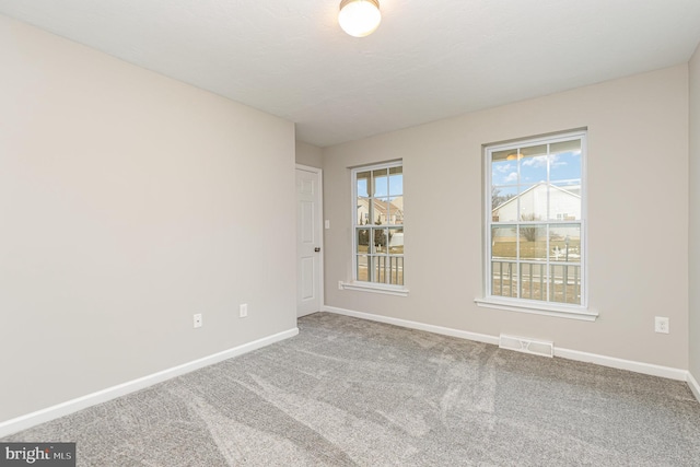 view of carpeted spare room