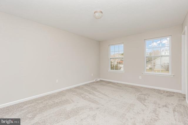 view of carpeted spare room