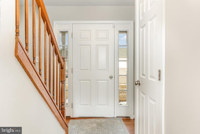 foyer entrance featuring hardwood / wood-style flooring and plenty of natural light