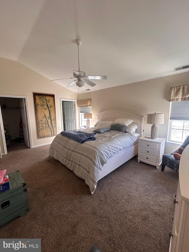 bedroom with ceiling fan, a closet, carpet floors, and vaulted ceiling