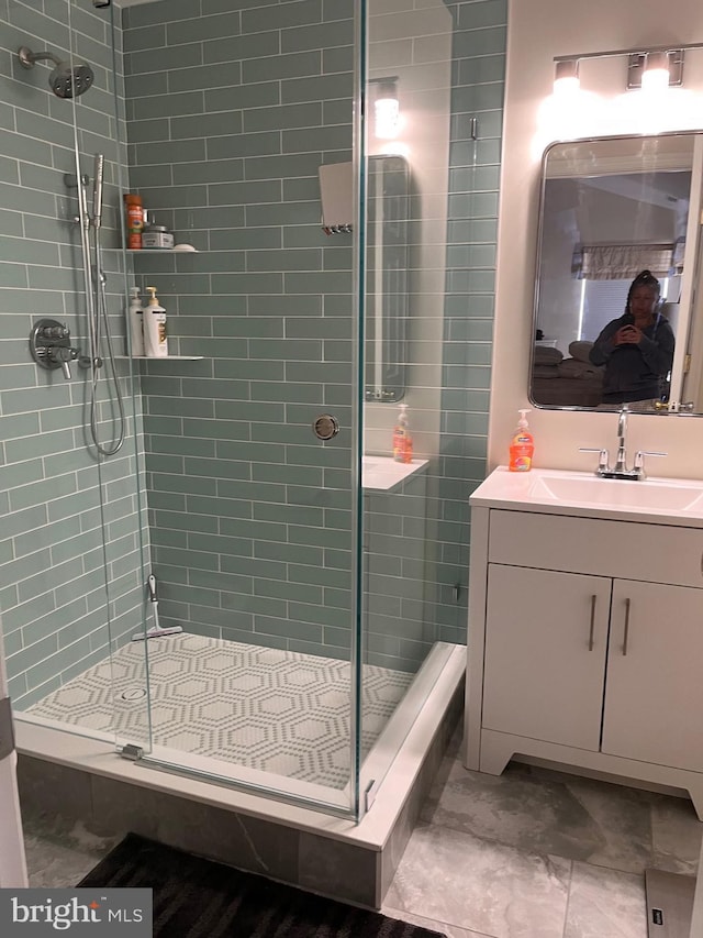 bathroom featuring vanity and walk in shower